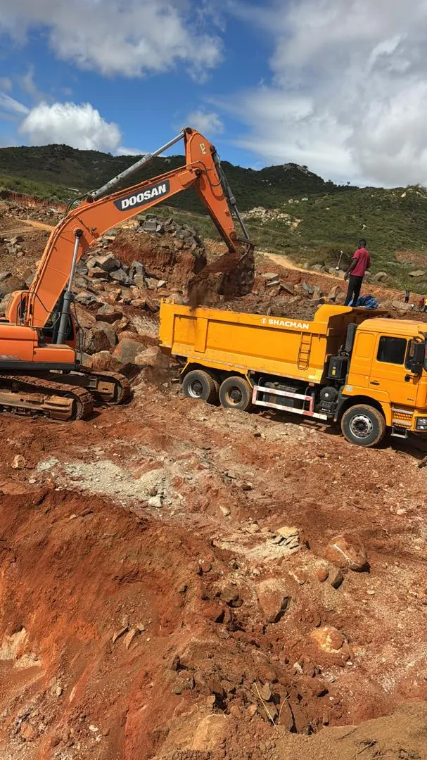 Excavator loading a tipper truck
