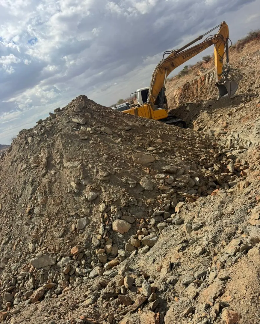 Excavator working a large excavation face