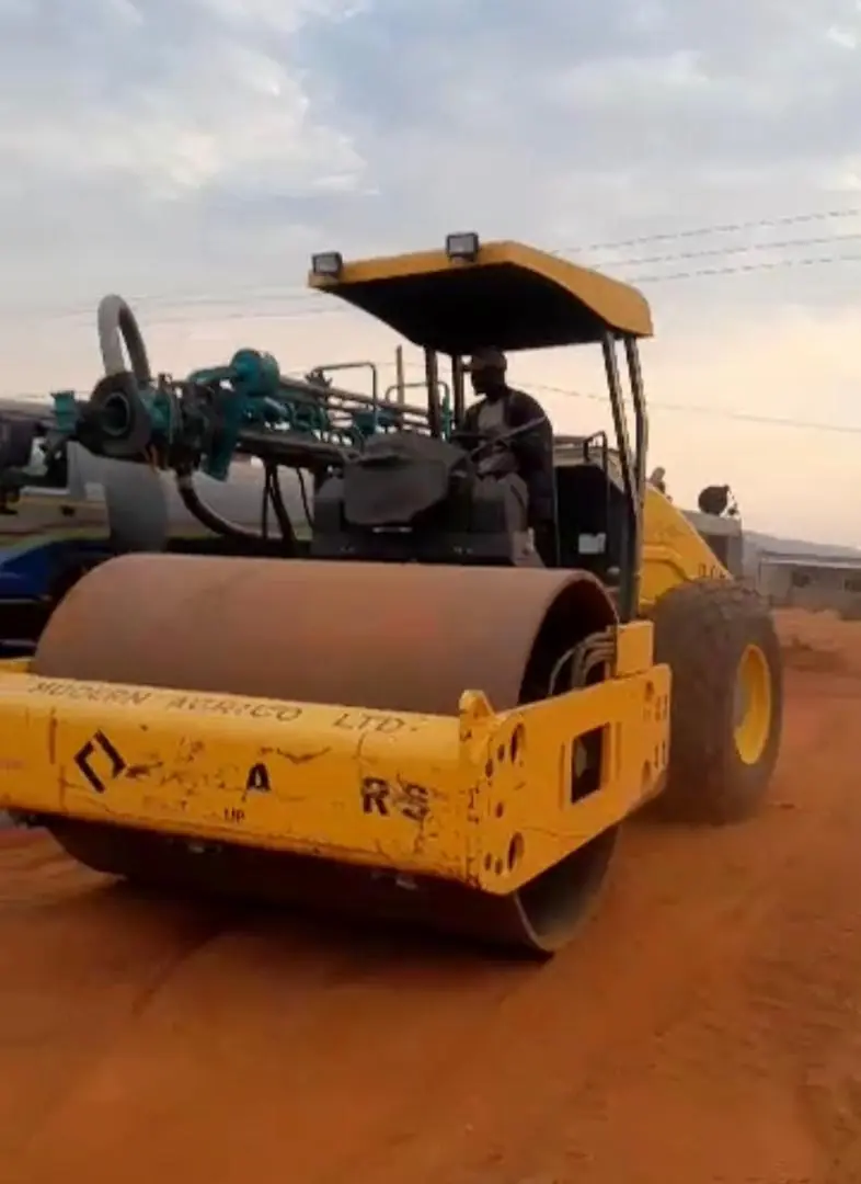 Wheel roller compacting a haul road
