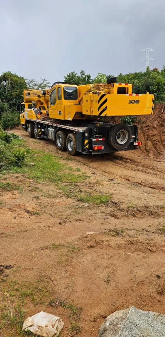 Mobile crane being transported to site on a flatbed